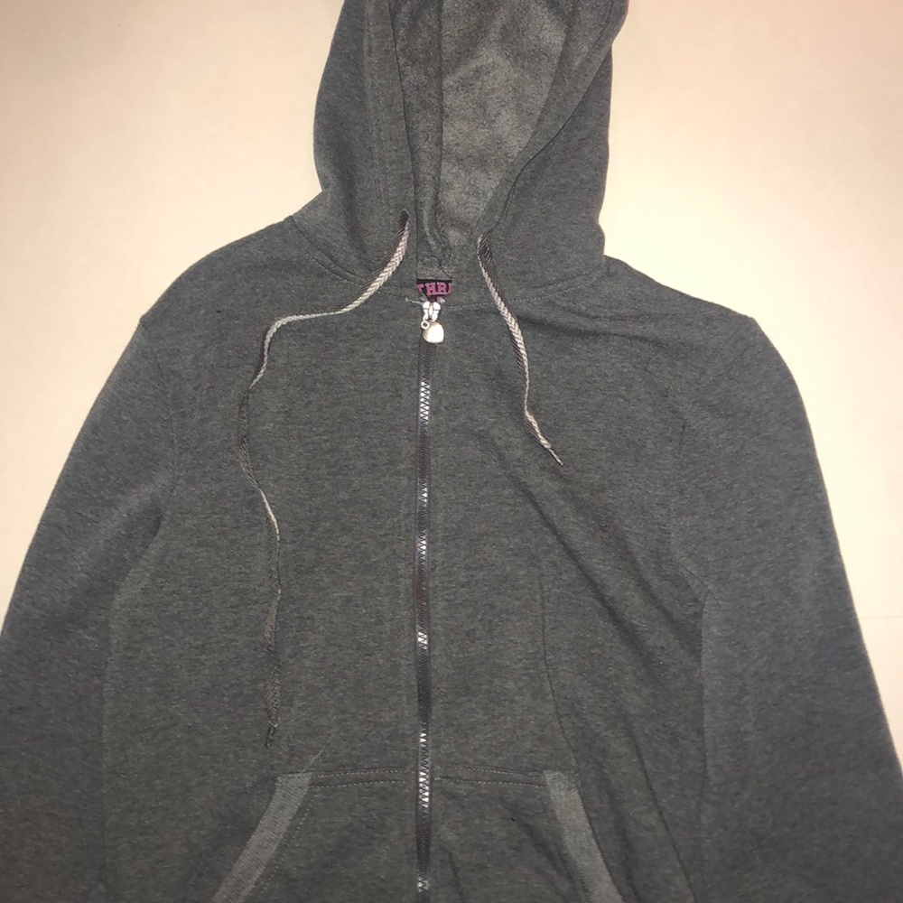 Gray zip up hoodie.